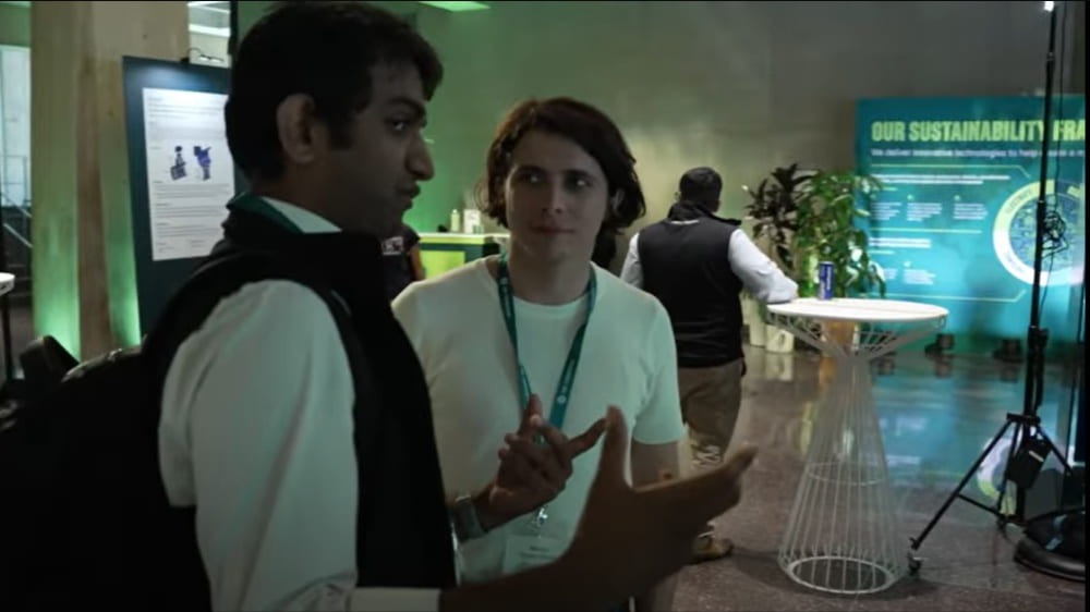 Two men chat during an event