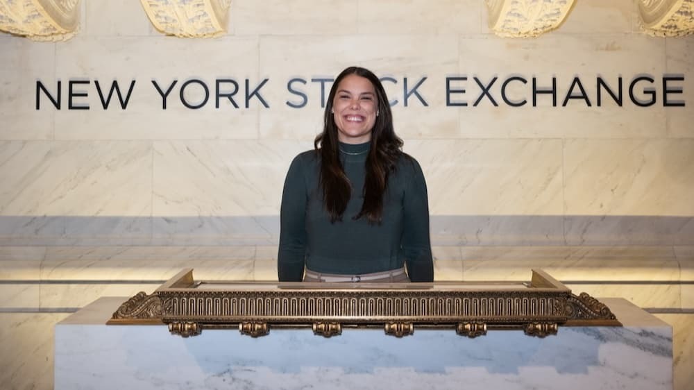 Woman standing in front of NYSE sign